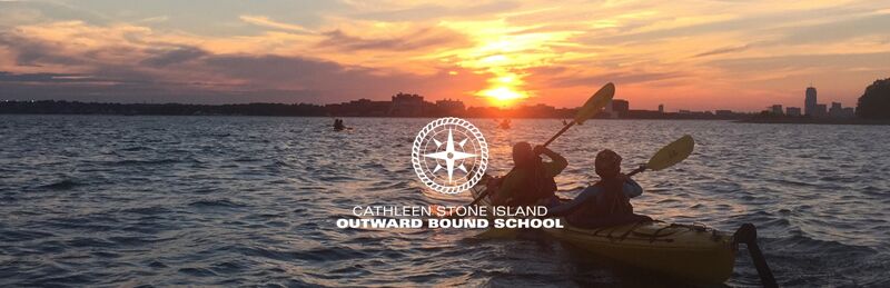 The image shows two people kayaking on a lake at sunset. The sky is filled with vibrant colors, and the water reflects the light. In the center, there is a logo that says "Cathleen Stone Island Outward Bound School". The silhouette of a city can be seen in the background.